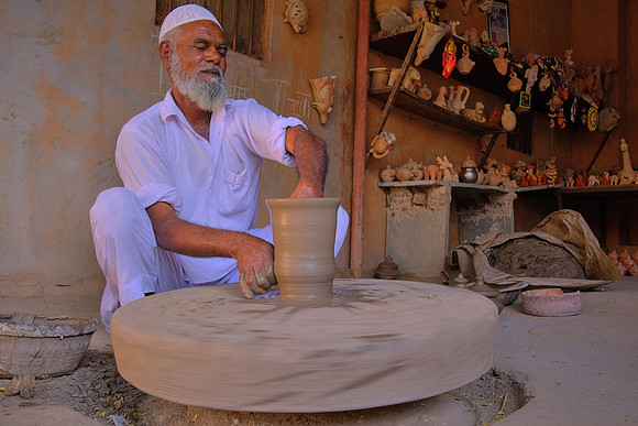 Throwing pots in rural Rajasthan, India.