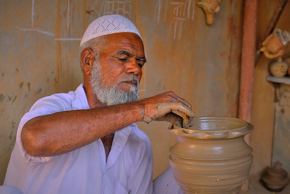 Throwing pots in rural Rajasthan, India.
