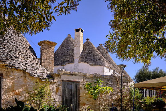 The trulli is a traditional Apulian dry stone hut with a conical roof.