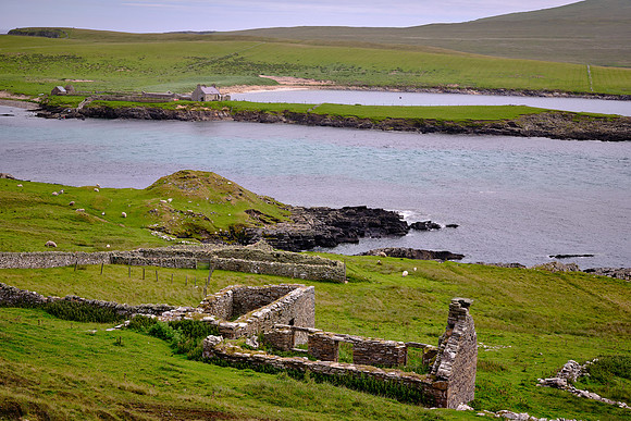 Across the water body lies the Isle of Noss and the remains of a Viking longhouse.