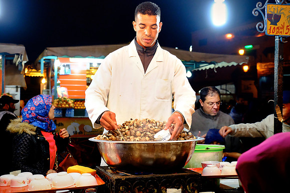 Snail server, Night lunch at the Medina, Marrakesh, Morocco