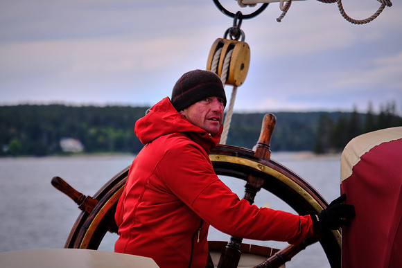 Captain Dennis Gallant at the helm, Windjammer Angelique, Camden, Maine