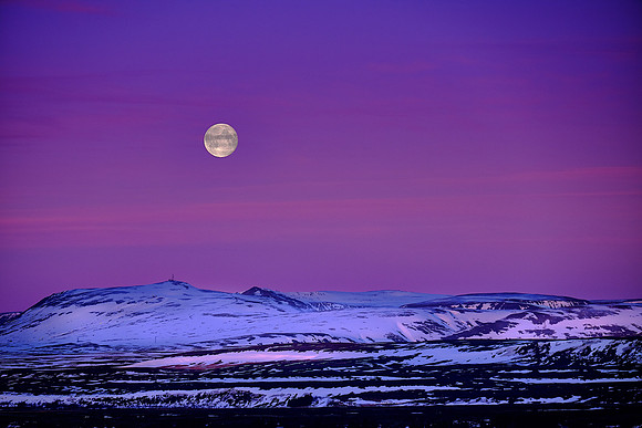 Moon set at sunrise over Fludir, Iceland