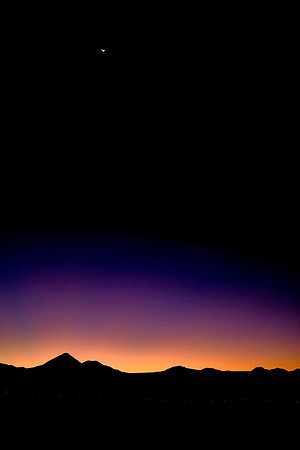 Moon set at sunrise over San Pedro de Atacama, Chile
