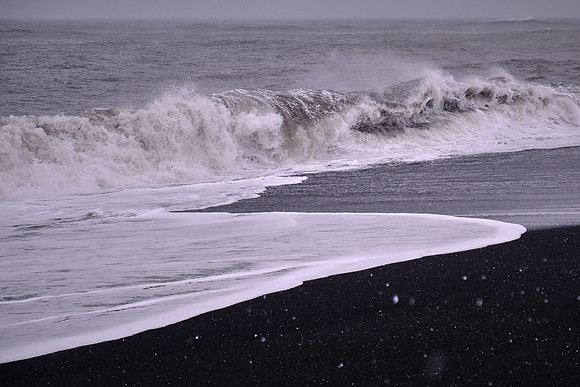 South shore Atlantic Ocean and black sand beach in the snow, Vik, Iceland