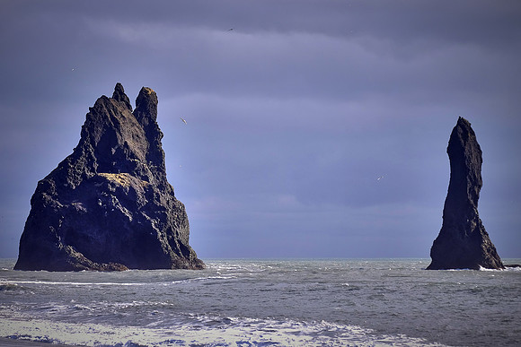 Dyrholaey sea stacks carved by ocean, south central coast near Vik, Iceland