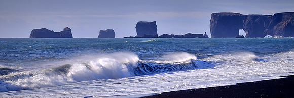 Dyrholaey "windows" carved by ocean, south central coast near Vik, Iceland