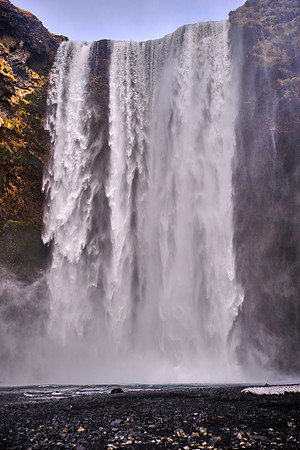 Skógafoss waterfall (one of the largest in country: 82 ft wide, 200 ft drop), south coast, Iceland
