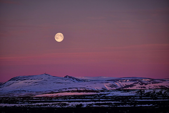 Moon set at sunrise over Fludir, Iceland