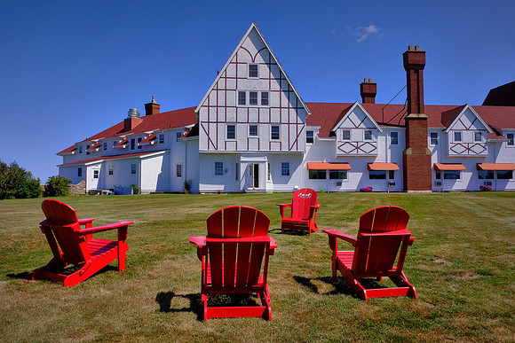 Four Red Chairs WIth A View of Keltic Lodge Resort and Spa, Ingonish Beach, Cape Breton Island, Nova Scotia