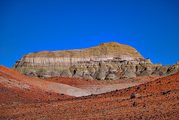 The clay over the coal layer was metamorphosed by the heat into red "clinkers" that look today like tiny pottery sherds.