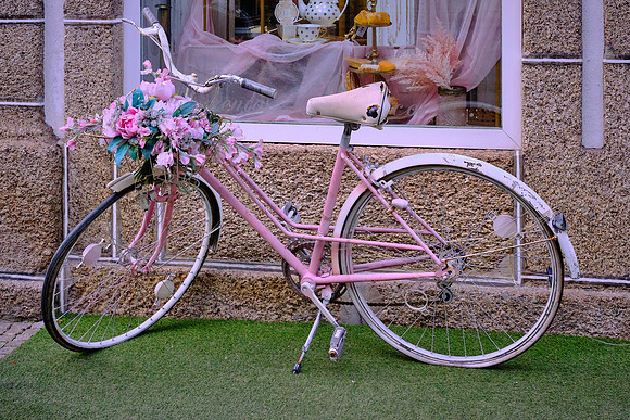 A bicycle parked in front of a shop traditionally meant that the shop was open for business.