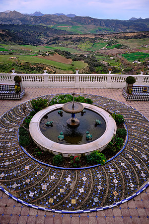 The mansion has a patio garden that overlooks the valley below.