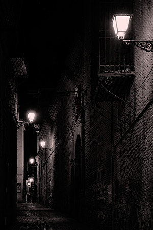 The backstreets of Toledo by night.