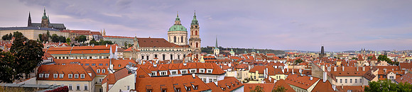 Prague with St. Vitus Cathedral to the left, St Nicholas Church and Sternberg Palace in the center of the image, and the Charles Bridge to the right.