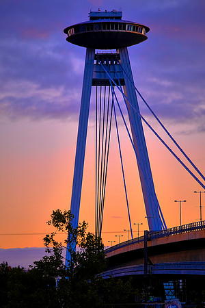 UFO Tower of Bratislava at sunset over Danube River, constructed in 1967-72.