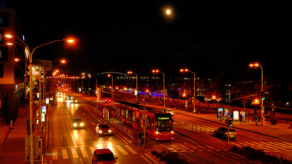 Bratislava Viedenska cesta thoroughfare by UFO bridge along Danube River at night.