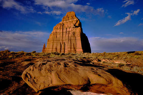 Temple of the Sun, UT.  The Entrada Sandstone crumbles easily to sand that  is rapidly removed by water; therefore, talus slopes do not form and the cliffs tend to rise sheer from their base.