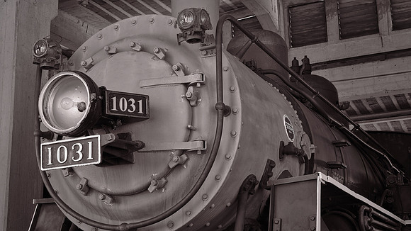 The bright copper rings atop the smokestacks earned the locomotive the nickname of "Cooperhead."