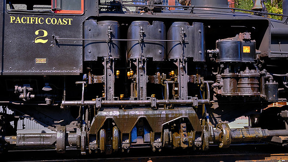 Shay locomotives had regular fire-tube boilers offset to the left to provide space for, and counterbalance the weight of, a two or three cylinder "motor."