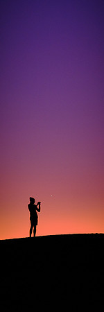Astrophotographer at sunset over White Sands National Monument, New Mexico