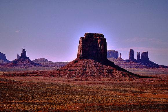 Monument Valley, UT.  The buttes are clearly stratified into three layers.