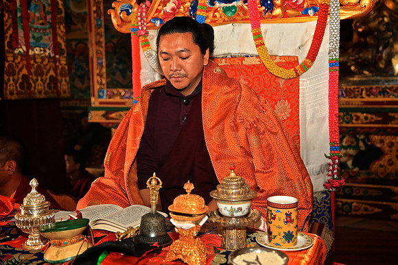 Bhikshu (high Buddhist priest) in prayer session, Boudhanath Stupa, Kathmandu, Nepal