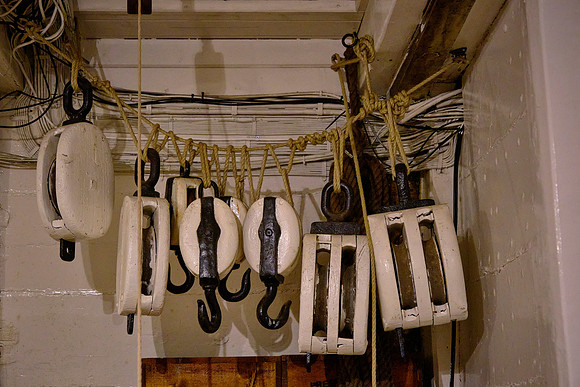The original cushions for the wardroom were changed when it was found they included steel-backed buttons.