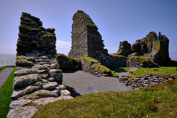 The Iron Age ruins include a broch and a defensive wall around the site.